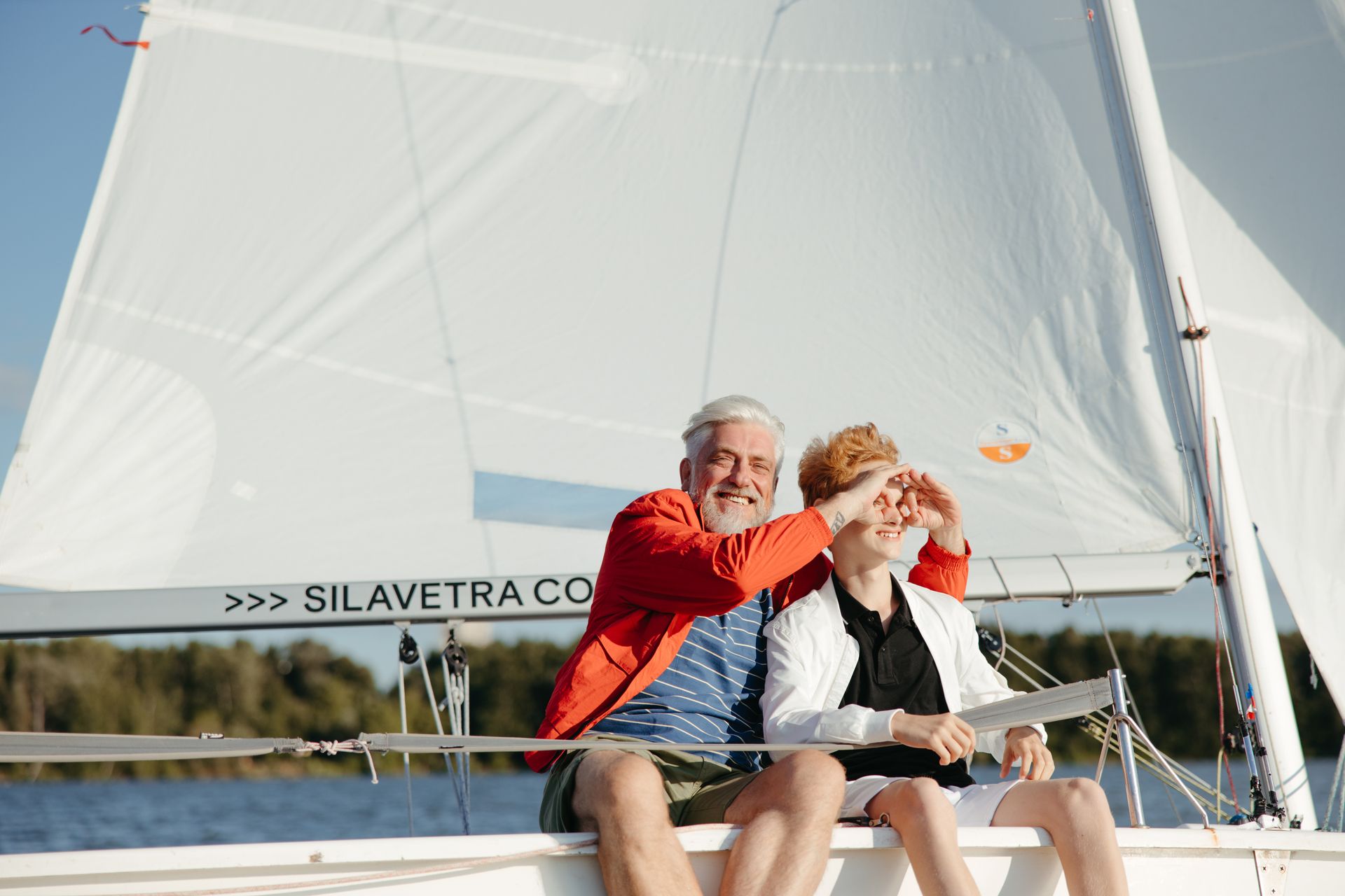 Happy energetic older couple with suitcases, boarding, beach or cultural trip
